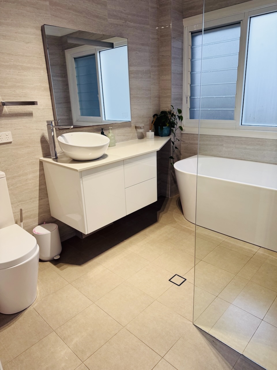 Modern bathroom with freestanding tub, spotless
