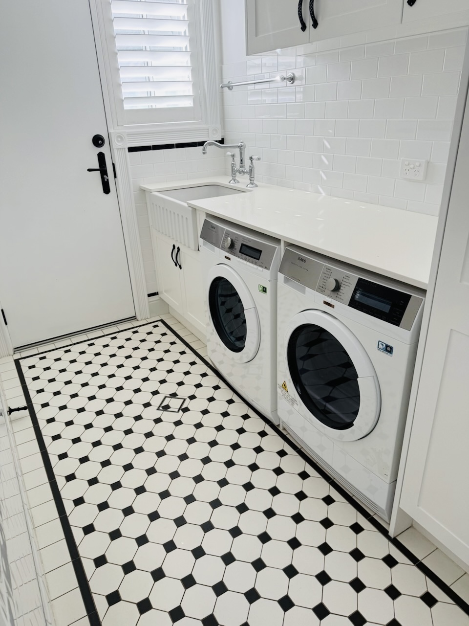 Checkerboard-tile laundry after a Myall Maids clean