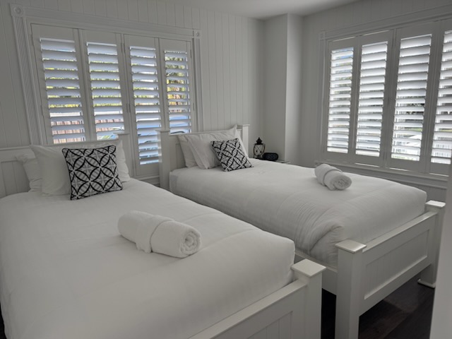Twin guest-suite beds after a Myall Maids turnover